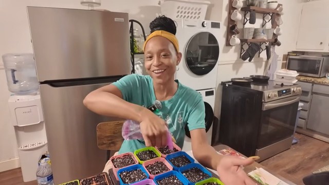 Asia watering seeds.