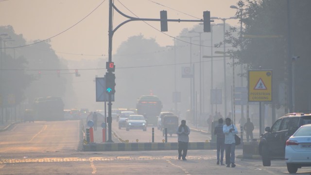 A city street with heavy smog.