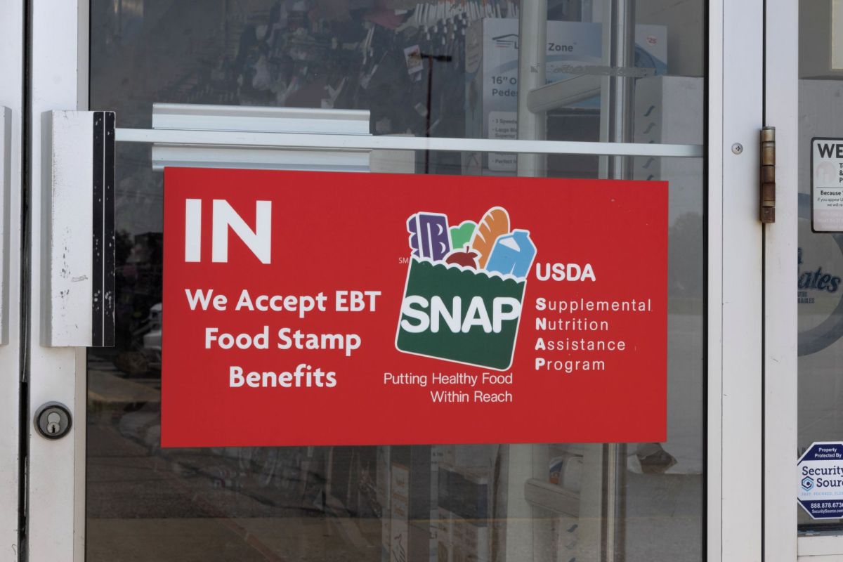 A "SNAP" sign on a store's door.
