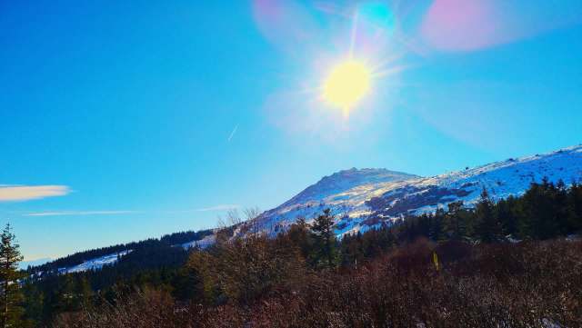 A snow-covered mountain on a sunny day.