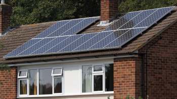 A house with solar panels installed on the roof.