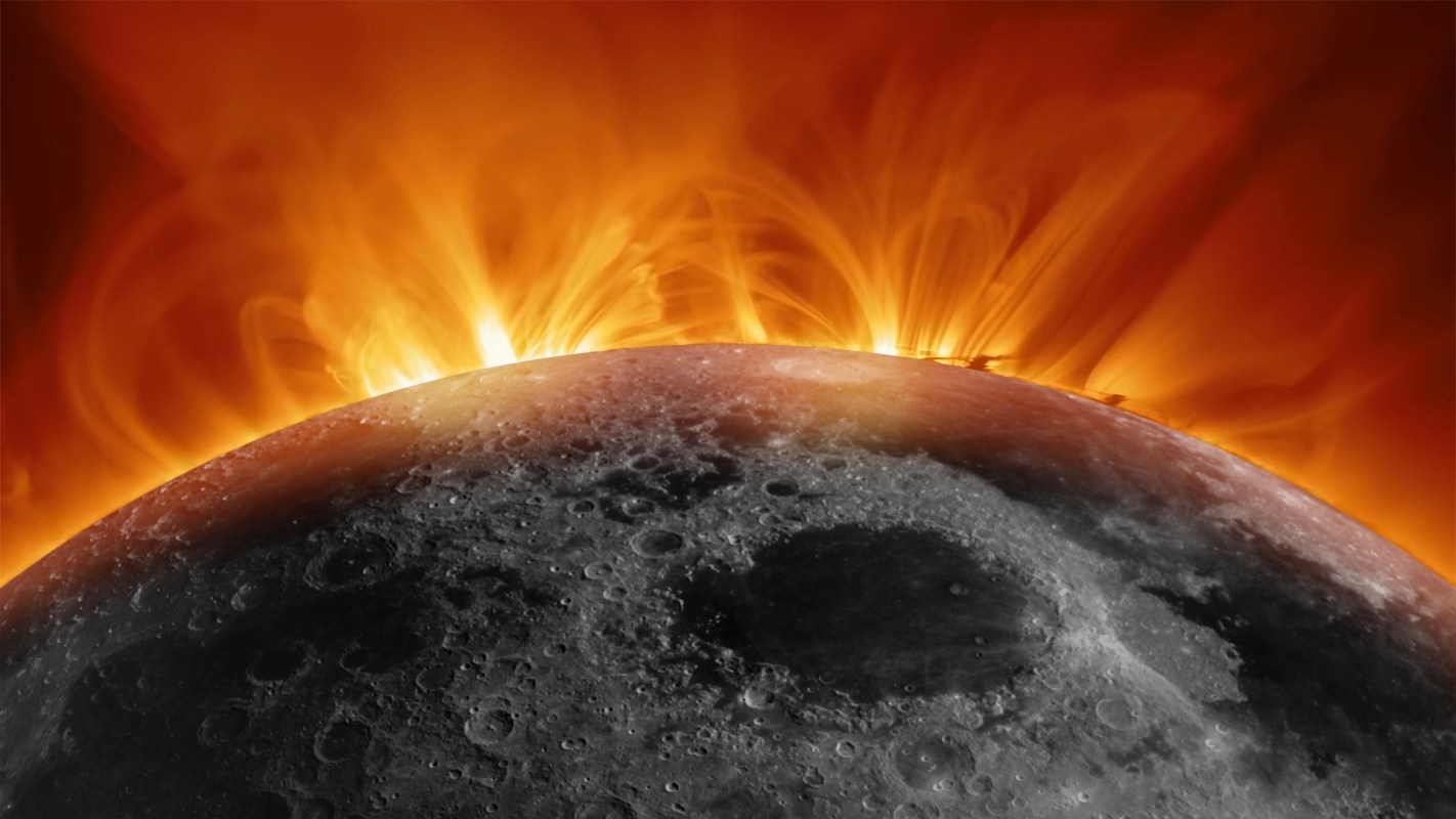 The sun's corona appears behind the moon, surrounded by fiery solar flares against a dark background.