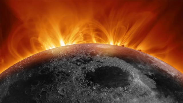 The sun's corona appears behind the moon, surrounded by fiery solar flares against a dark background.