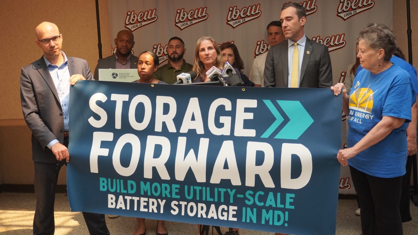 A news conference promoting battery storage projects.