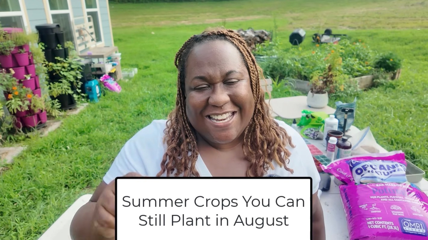 Barbara talking about summer crops in a garden.