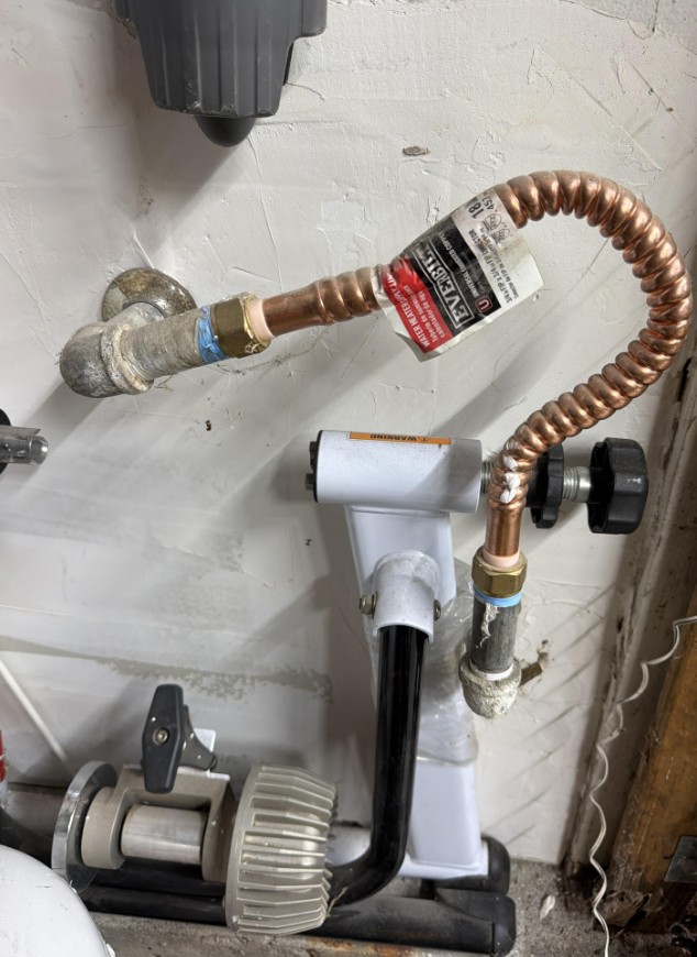 An odd-looking repair to a water heater supply line.