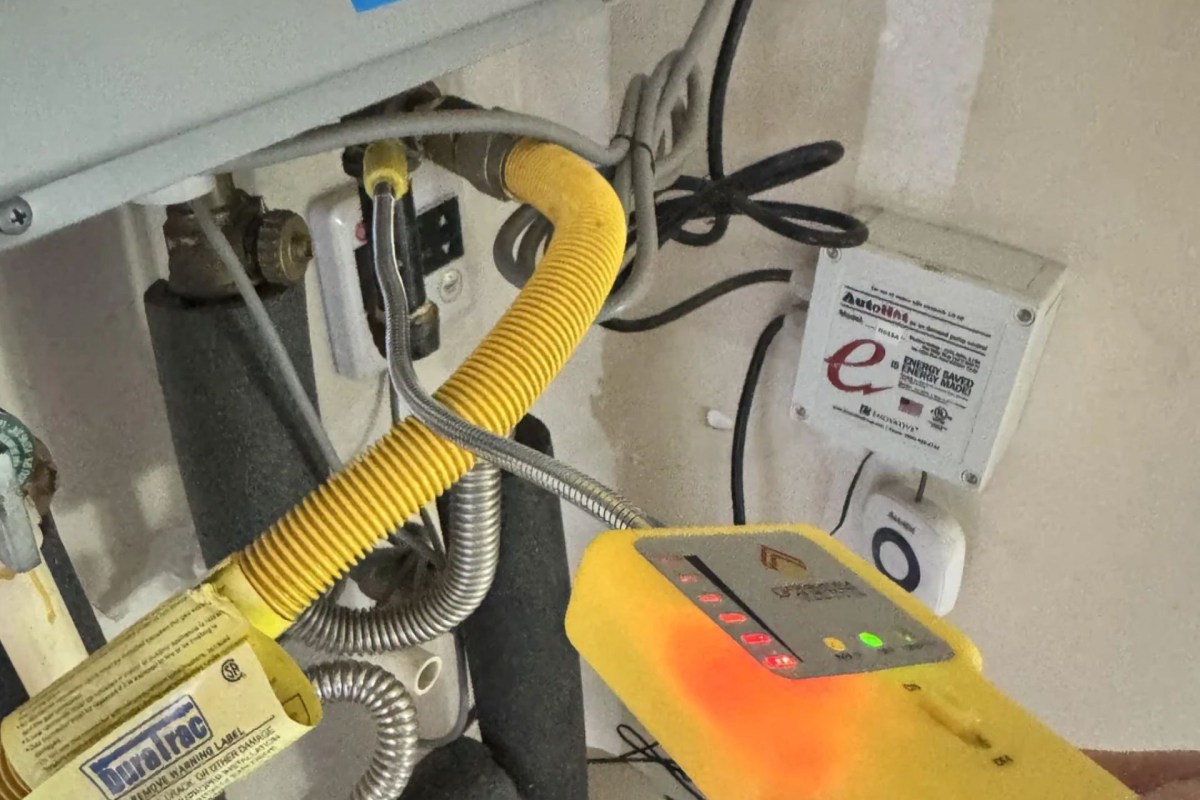 Checking for a gas leak in a tankless water heater.
