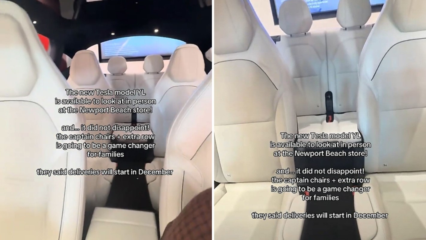 An interior view of a Tesla Model Y featuring white seating and a digital display.