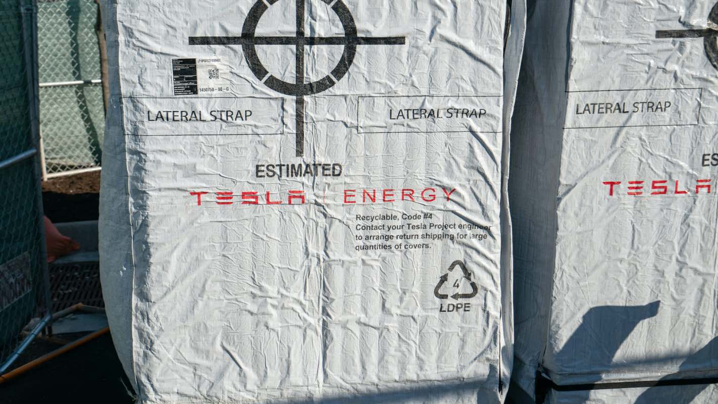 Tesla Energy products in company packaging.