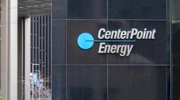 A sign for CenterPoint Energy on a building facade.