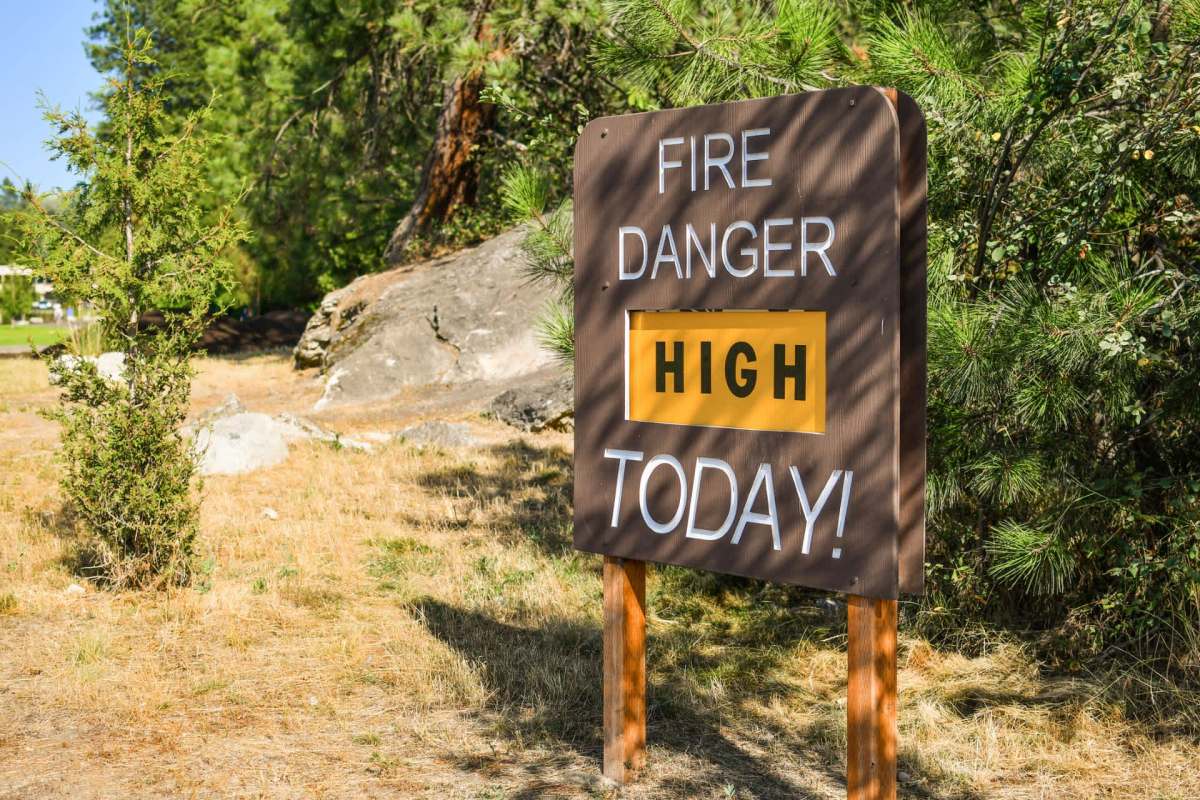 A "high fire danger" sign at a public park.