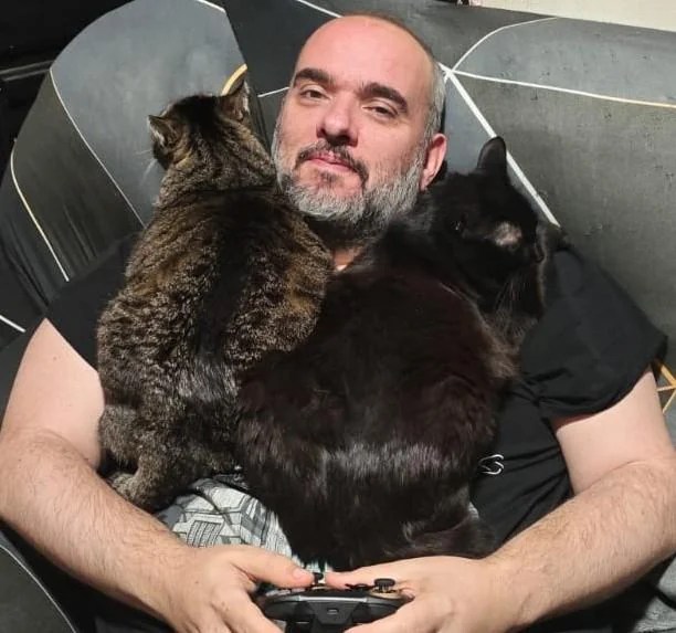 Full-grown cats on their rescuer's chest.