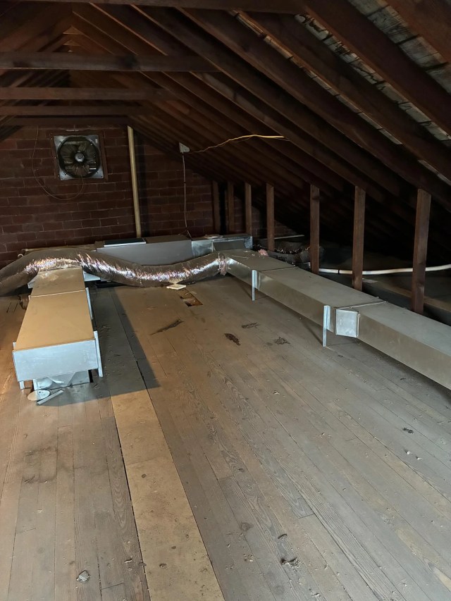 Exposed ductwork in an uninsulated attic.