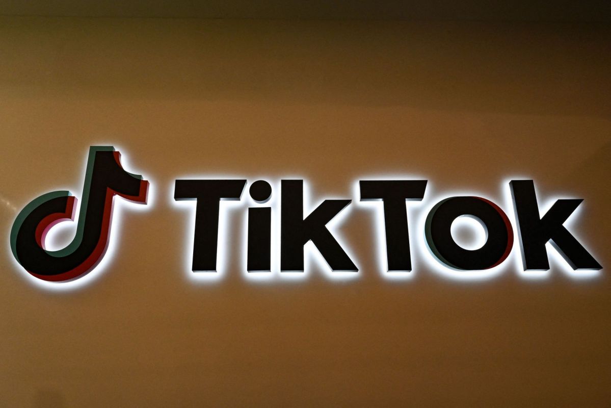 A TikTok logo on a wall.