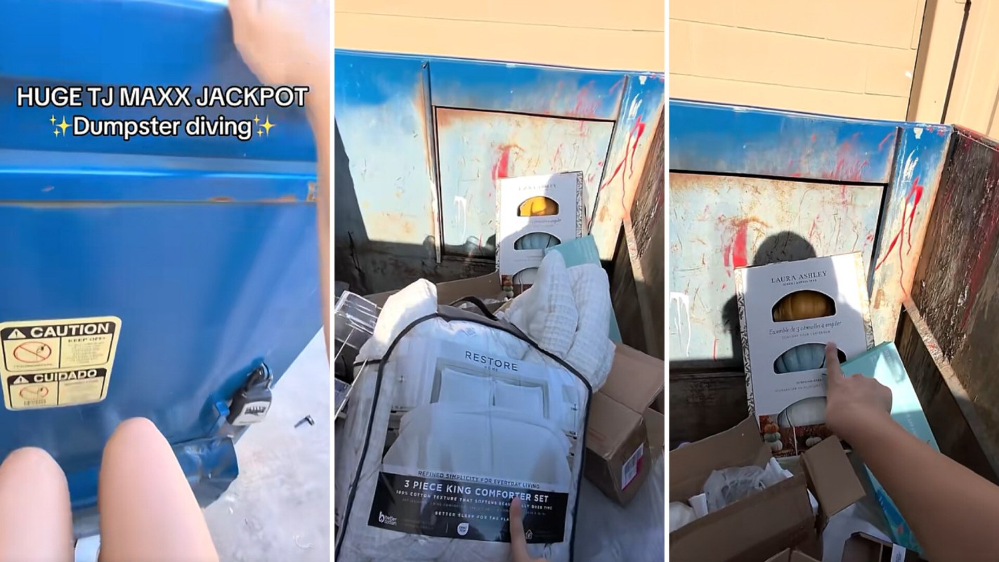 A dumpster containing various items including comforters and packaging.