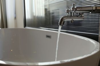 Water running into a bathtub.