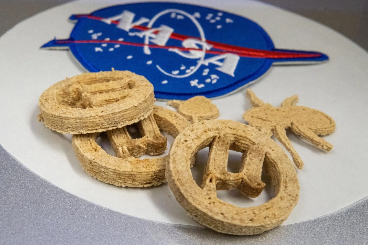 3D-printed cookies next to a NASA logo.