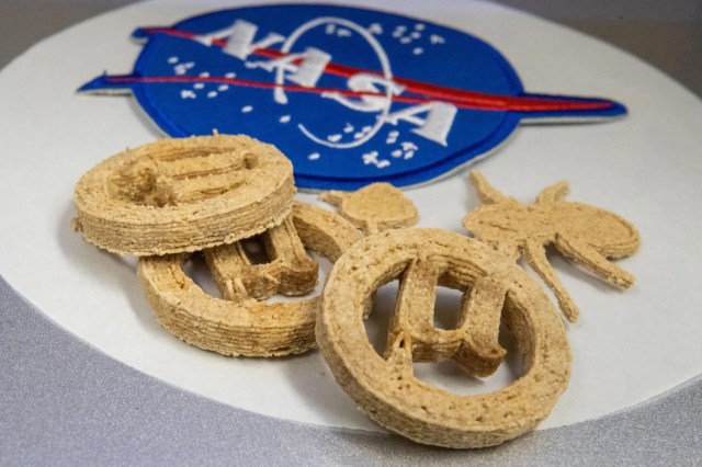 3D-printed cookies next to a NASA logo.