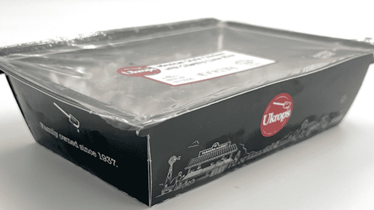 A prepared Ukrop meal with a plastic film lid.