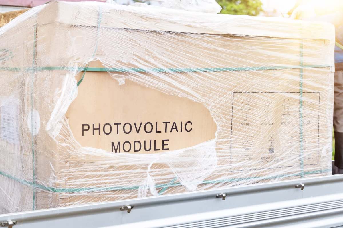 A wrapped box labeled "PHOTOVOLTAIC MODULE."