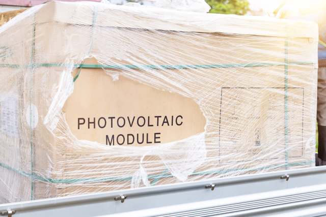 A wrapped box labeled "PHOTOVOLTAIC MODULE."