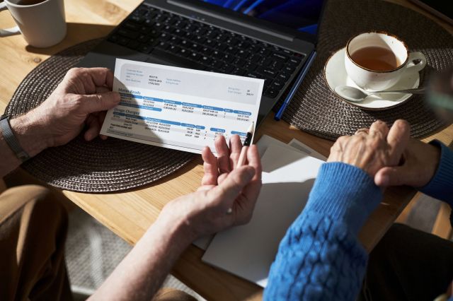 Two people looking at a utility bill.