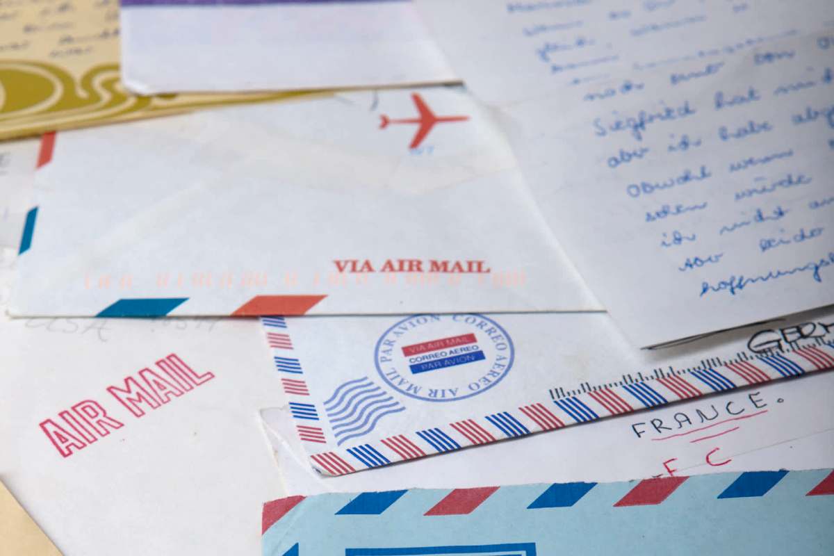 A collection of assorted envelopes and letters, some labeled as air mail.