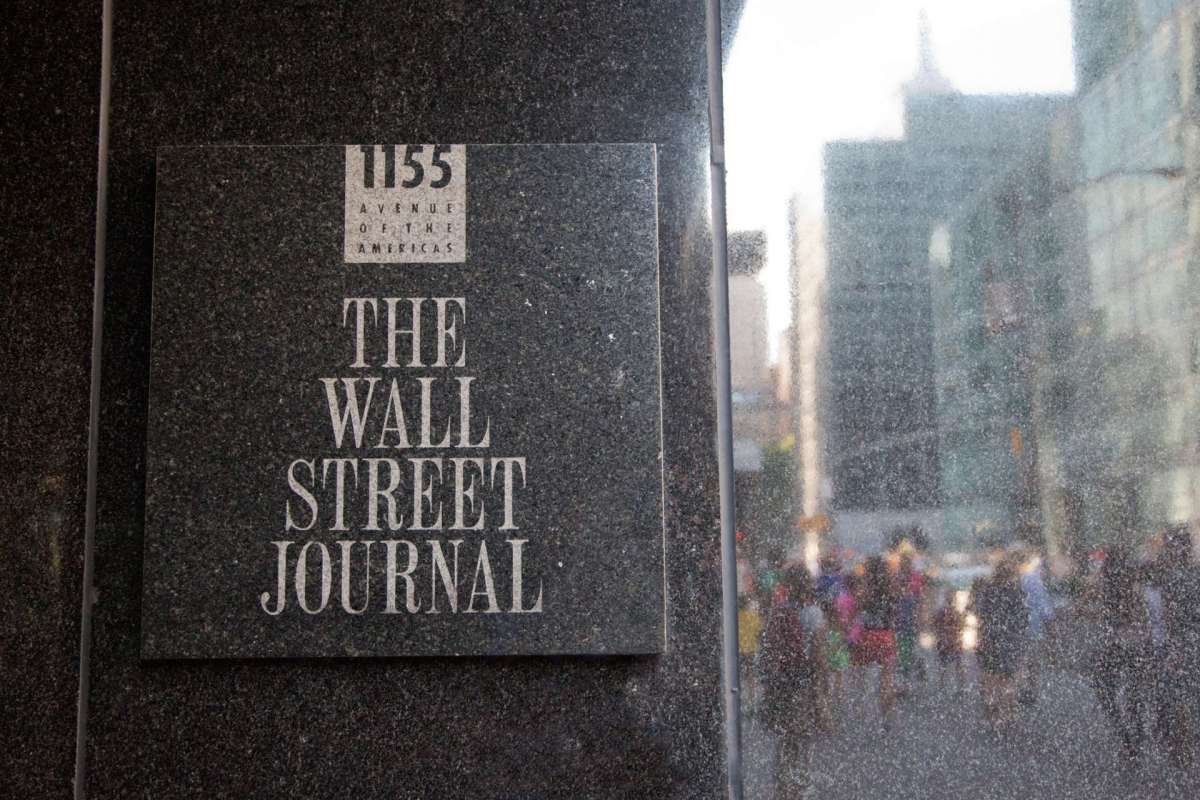 A sign for The Wall Street Journal located at 1155 Avenue of the Americas.