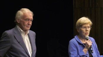 U.S. senators Ed Markey and Elizabeth Warren speaking stage.