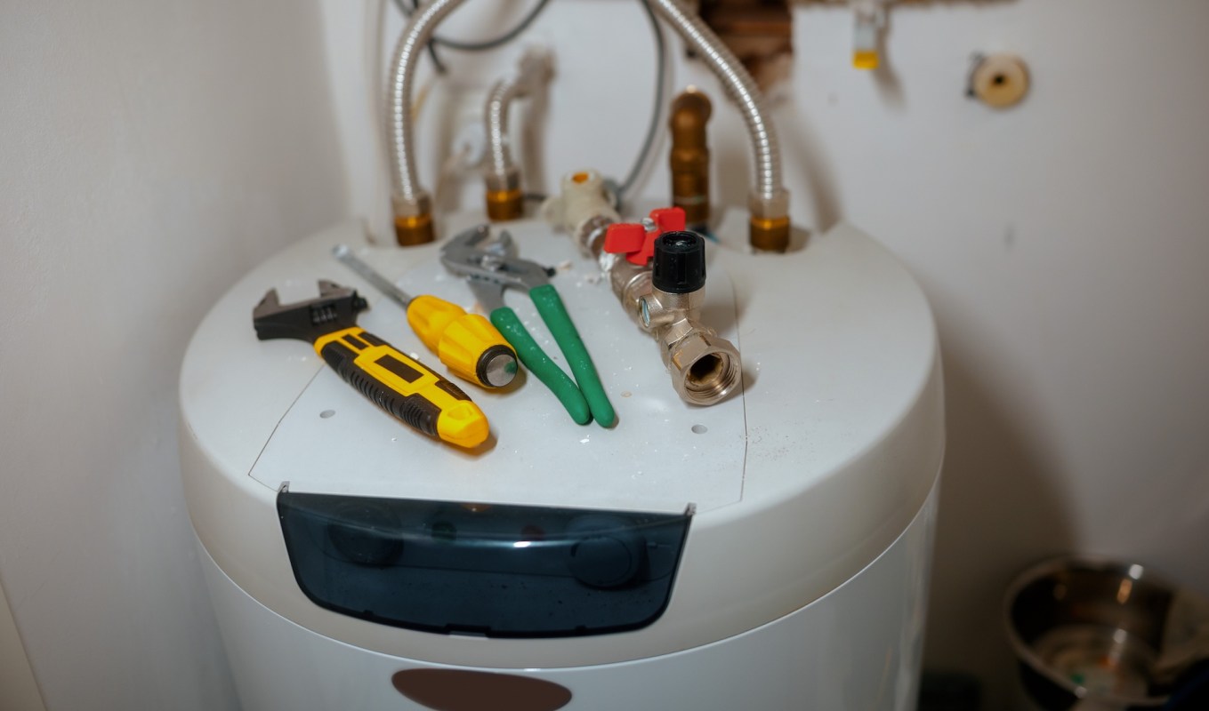 Tools on top of a water heater.