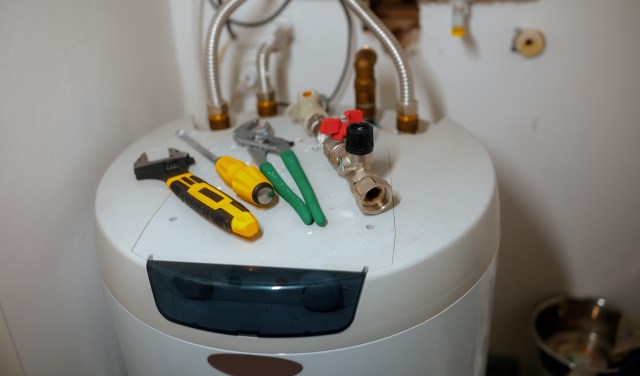 Tools on top of a water heater.