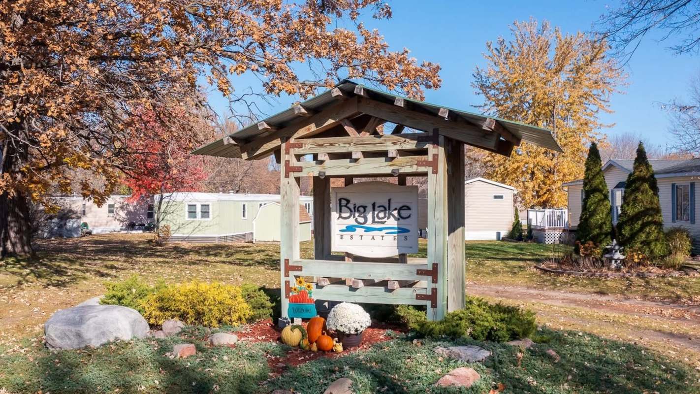 A wooden sign for Big Lake Estates.