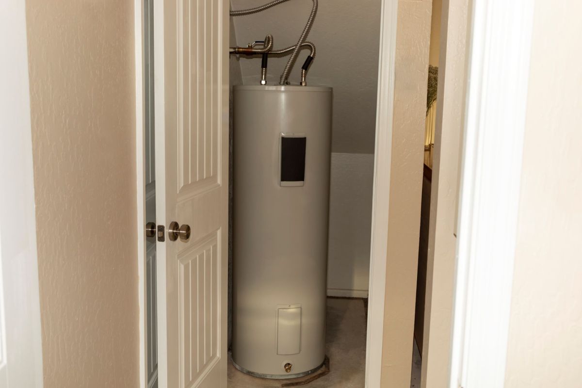 A water heater in a closet.