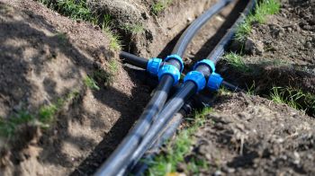 Water pipes surrounded by dirt.
