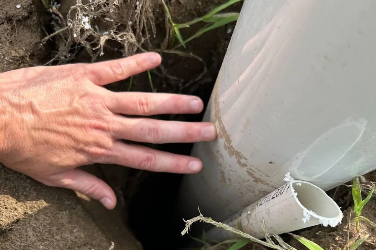 A water pipe in a hole.