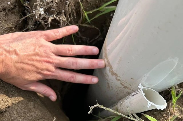 A water pipe in a hole.
