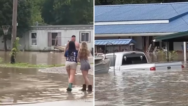 Buildings and a truck submerged in floodwaters.