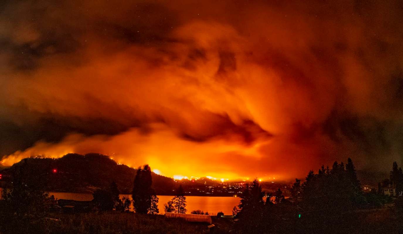 A wildfire near a lake.