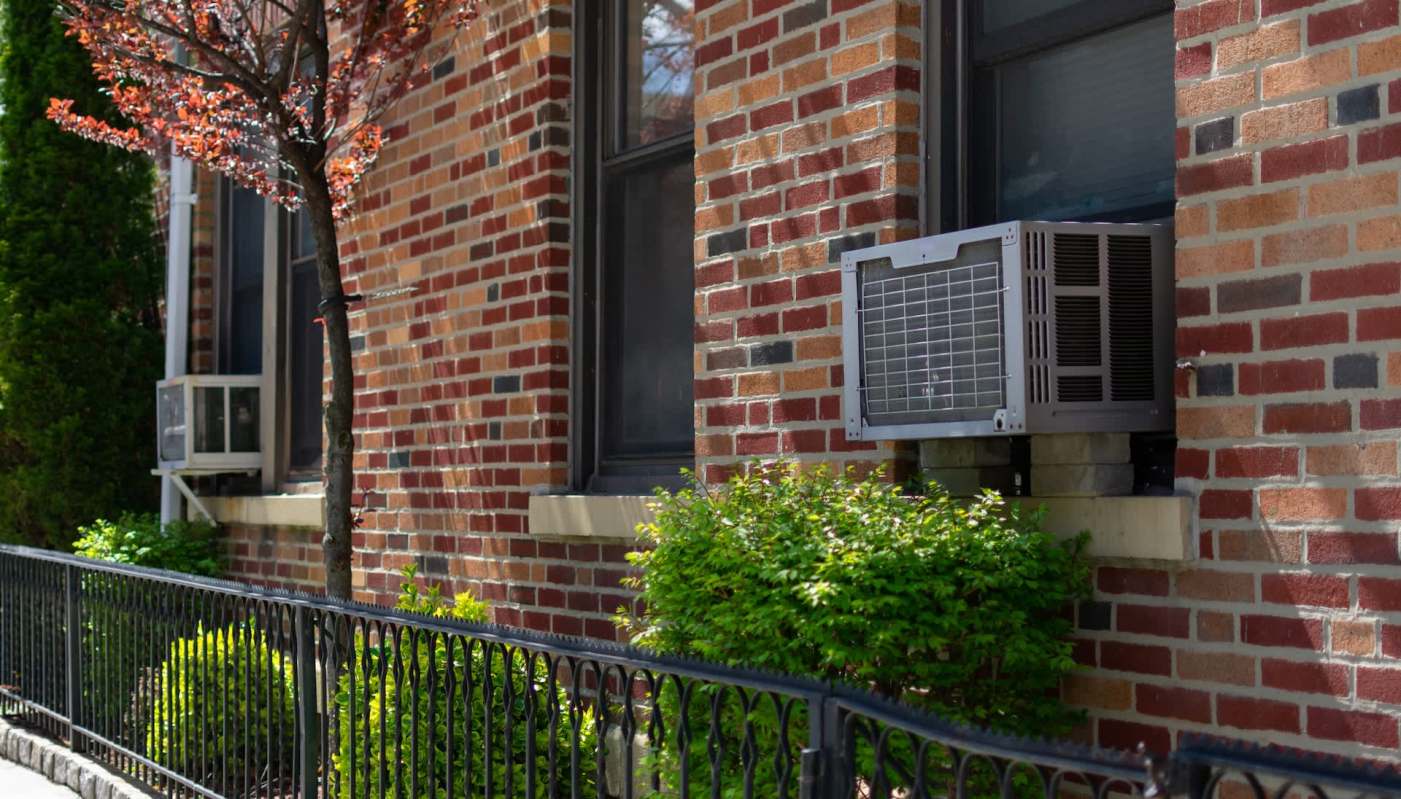 Window AC units on a brick building.