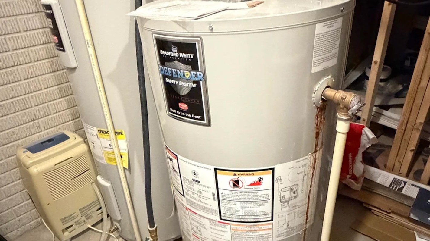 A water heater with rust stains.