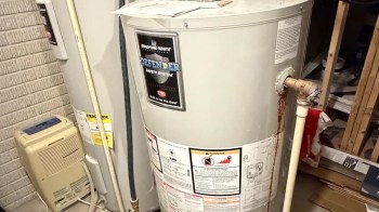 A water heater with rust stains.
