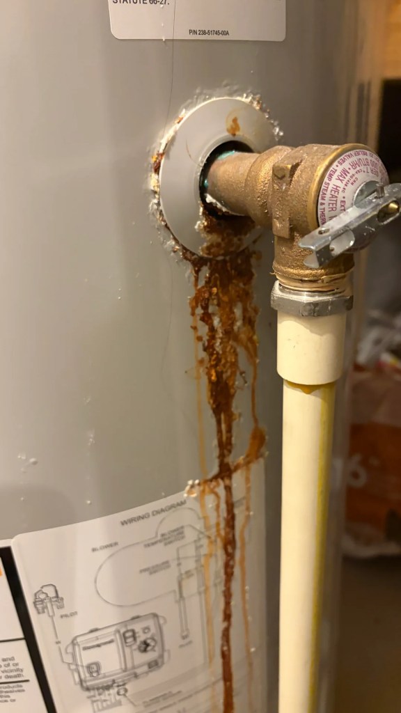 Rust around a temperature-and-pressure relief valve. 