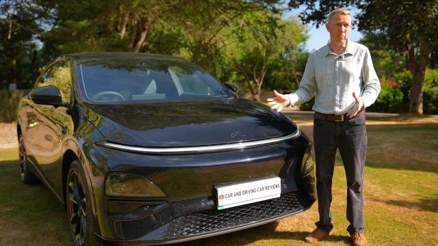 Car reviewer Jonathan Crouch next to an XPeng G6.