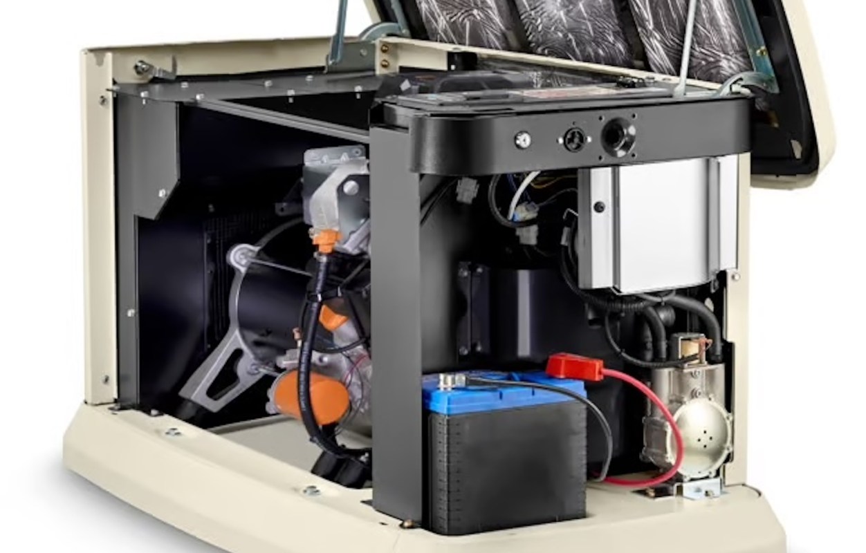 An open generator showing internal components including an engine, battery, and electrical wiring.