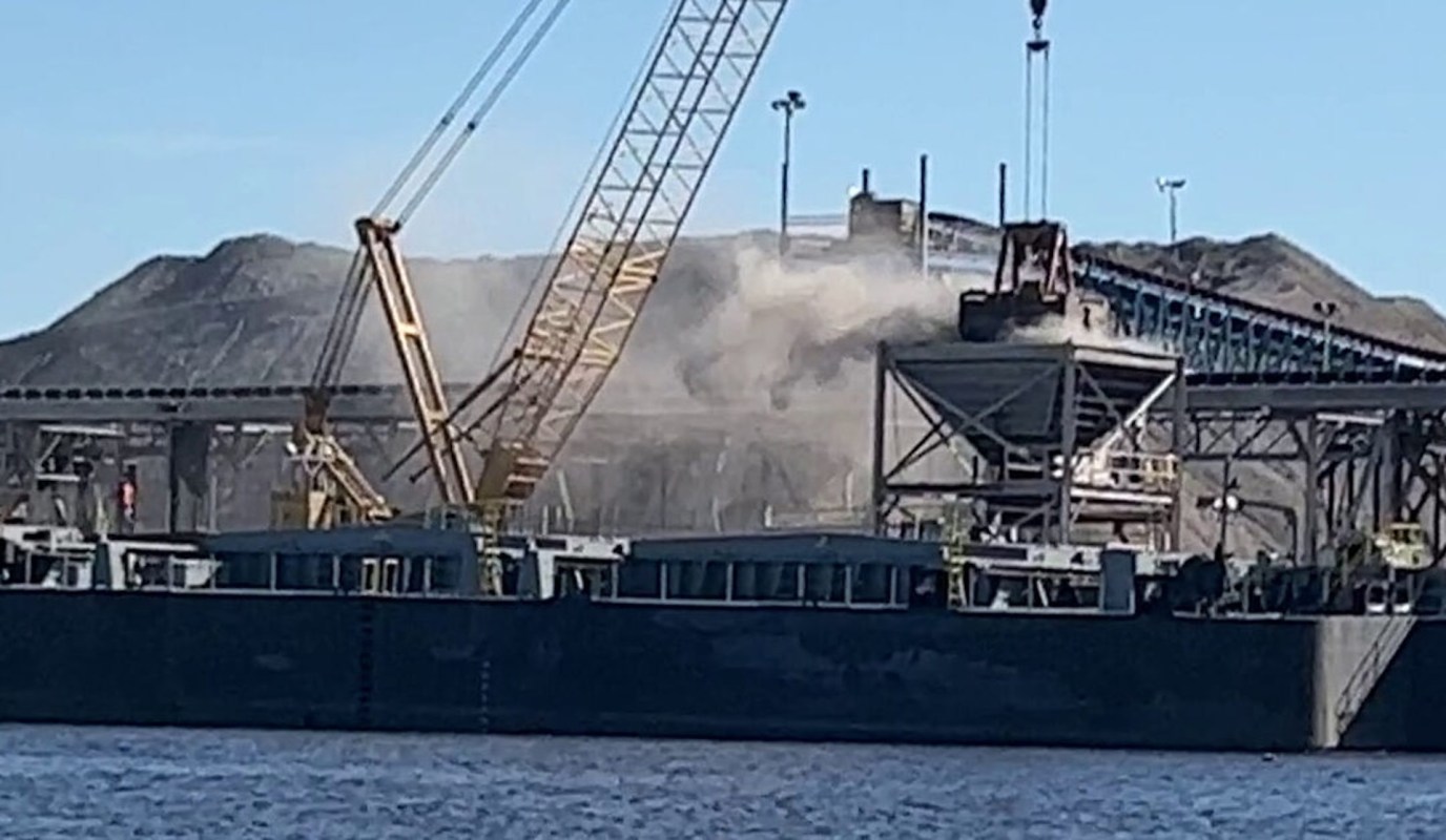 A barge at an industrial site.
