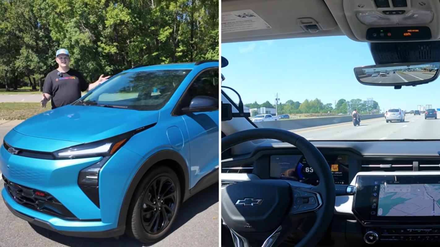 A person stands next to a blue Chevrolet electric vehicle in a park, with a view of a highway from inside the car.