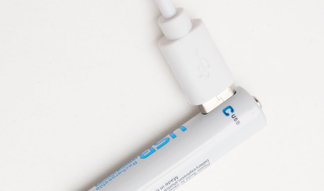 A USB-connected rechargeable AA battery on a white background.