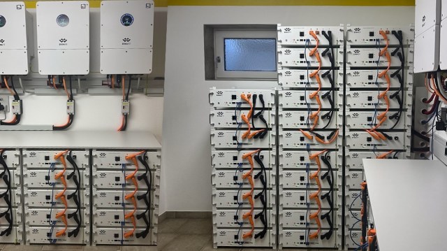 A wall of connected battery storage units.