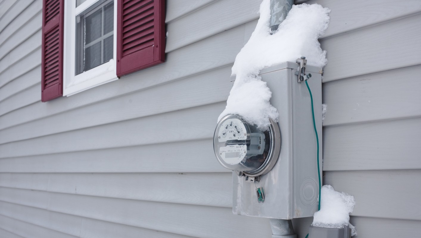 A snow-covered electric meter.