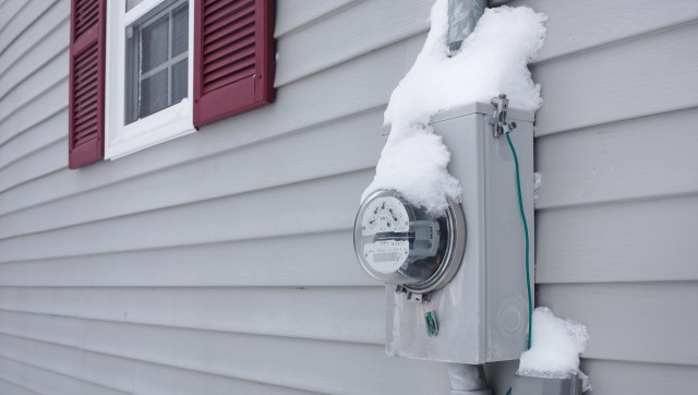 A snow-covered electric meter.